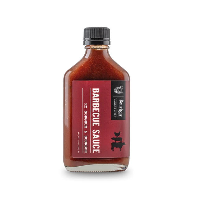 Barbecue sauce bottle with a red label on a white background