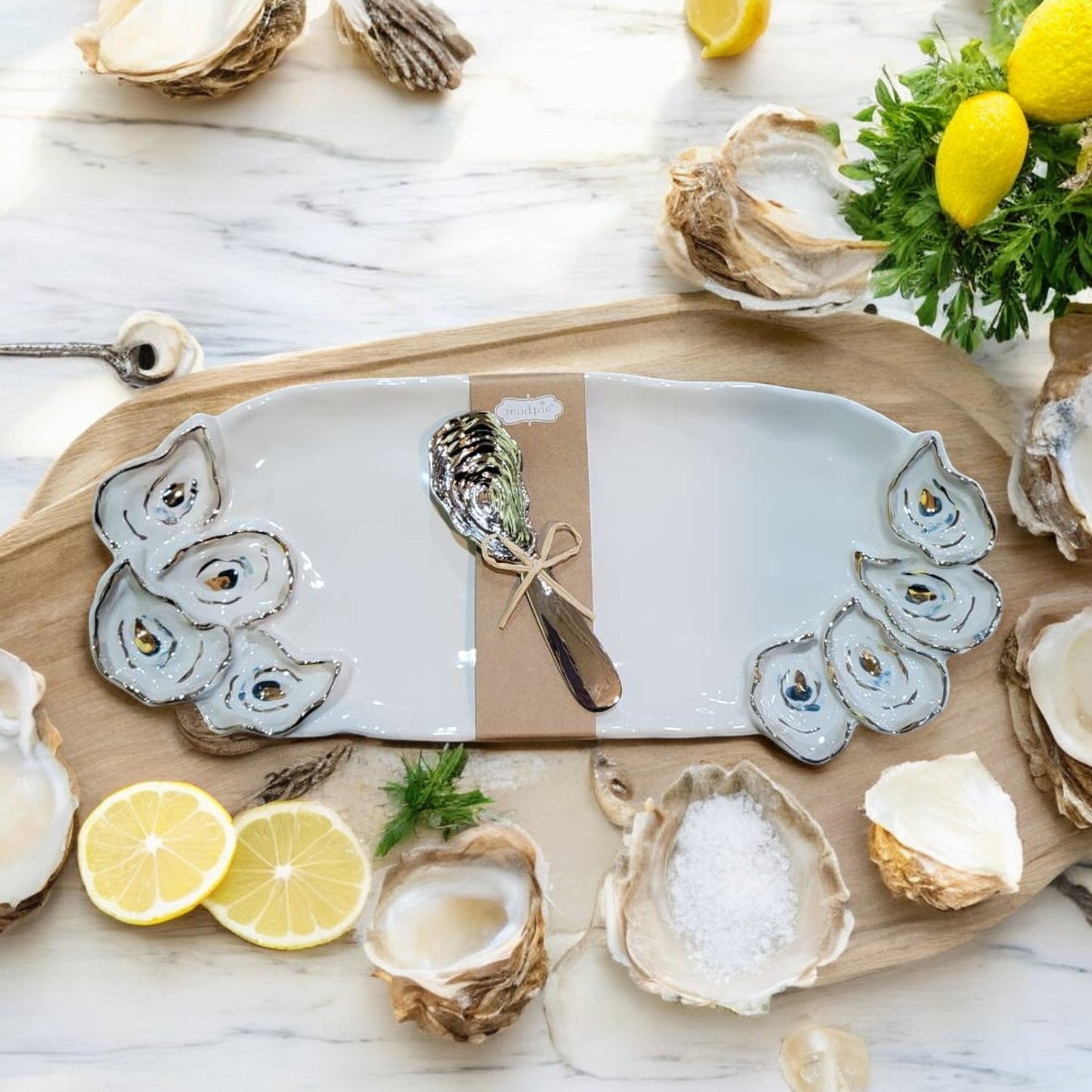 Layered oyster hostess set with a textured serving board and matching spreader, perfect for coastal-themed gatherings and entertaining.