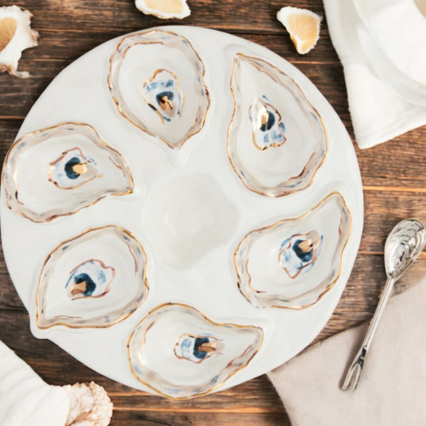 Oyster Server Set featuring a 10 1/2-inch stoneware server with stainless steel fork and spoon, perfect for serving seafood dishes elegantly.
