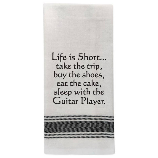Wild Hare Designs white cotton kitchen towel with black text reading “Life is short. Take the trip. Buy the shoes. Eat the cake.” Funny absorbent tea towel gift.