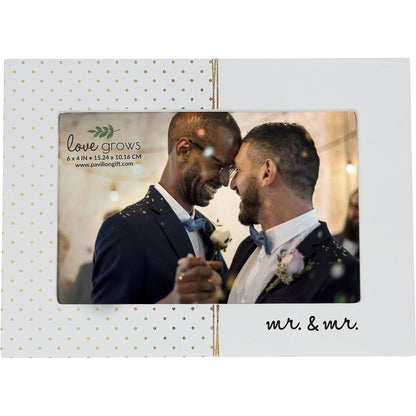 A 7.5" x 5.5" rustic whitewashed MDF photo frame with gold polka dots, metallic draped accents, and the sentiment "Mr. & Mr." Holds a 6" x 4" horizontal photo and features a sturdy easel back. Perfect for gifting to couples.