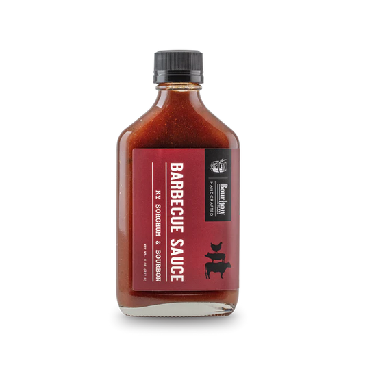Barbecue sauce bottle with a red label on a white background
