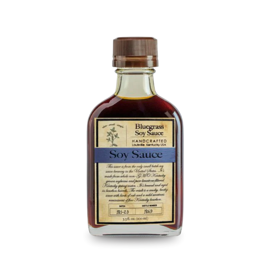 Bottle of Bluegrass Soy Sauce – small-batch, bourbon barrel-aged soy with meaty, briny flavor.

