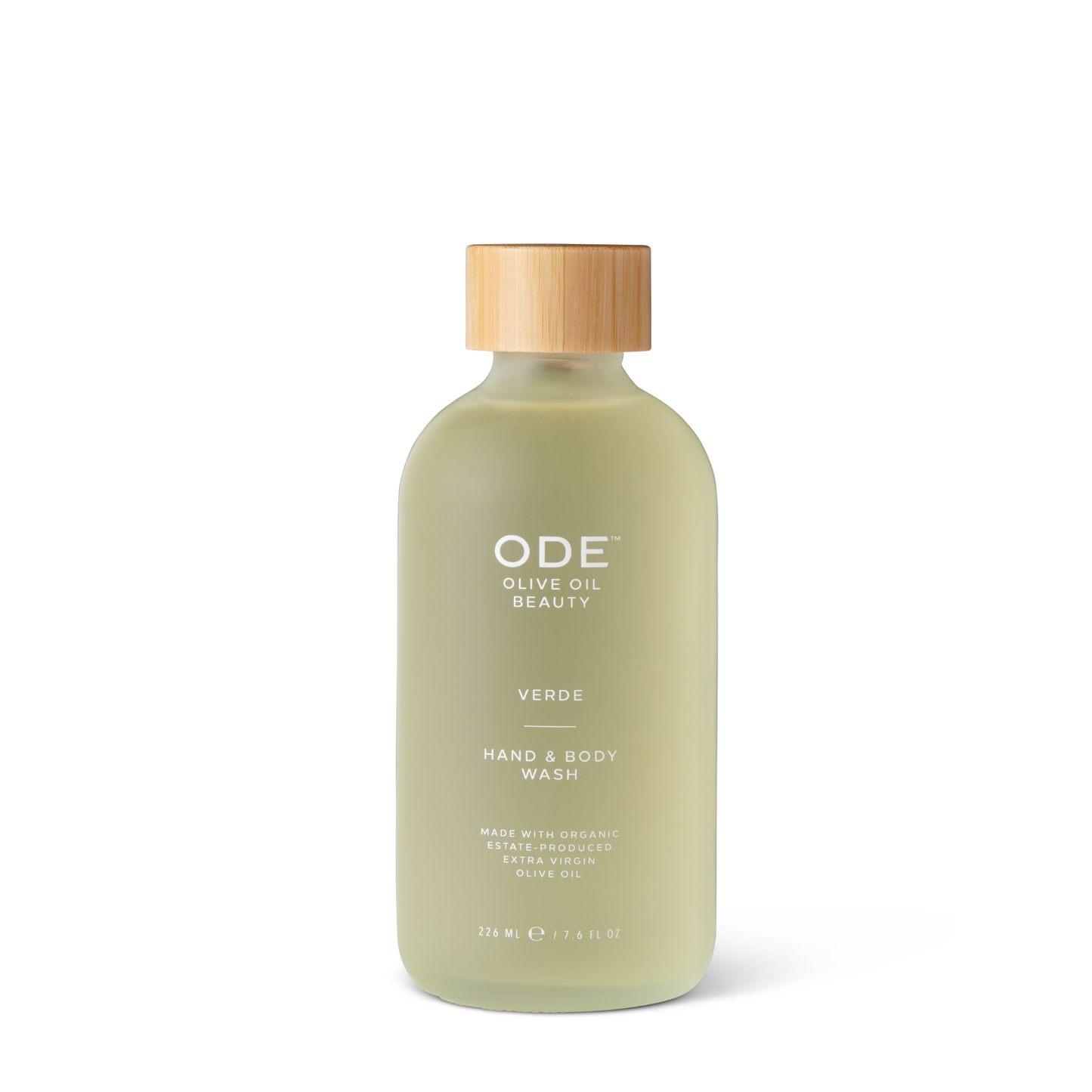 A pump bottle of ODE Olive Oil Beauty Hand & Body Wash with a beige cap and a label that includes the product name and the scent 'Verde'.