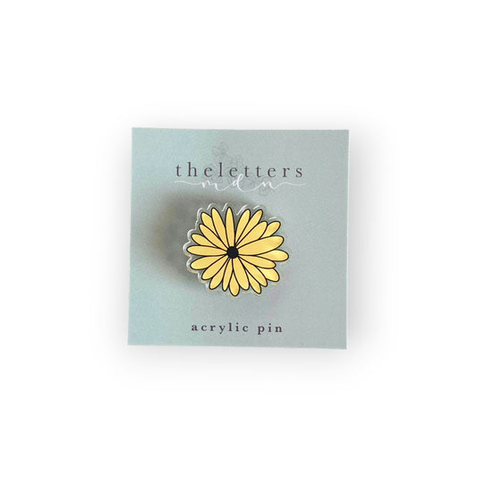 acrylic pin image of a black eyed Susan flower on cardstock