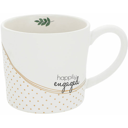 A 15 oz stoneware mug with "Happily Engaged" printed on the front, featuring a dimpled texture, metallic gold accents, and a large comfortable handle.